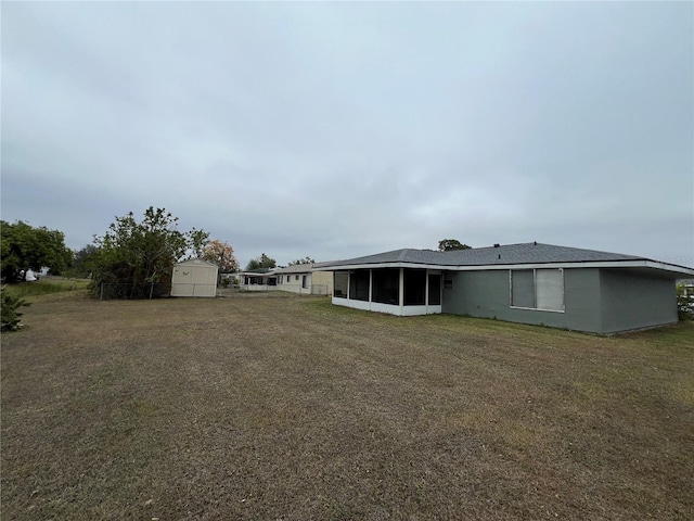 view of yard featuring a sunroom