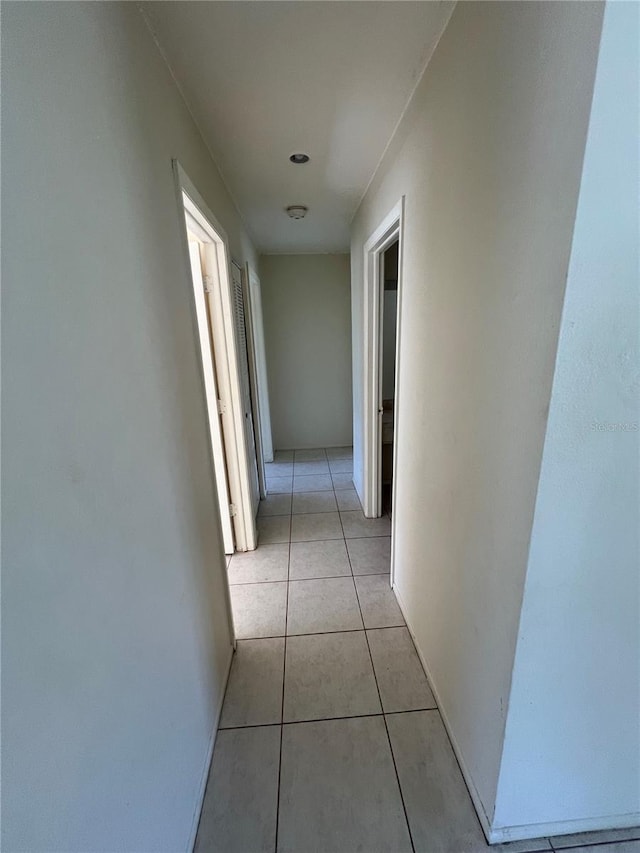 hallway with light tile patterned flooring