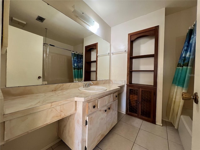 full bath featuring vanity, visible vents, and tile patterned floors