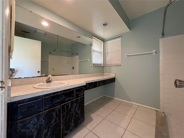 full bath with vanity, visible vents, walk in shower, and tile patterned floors