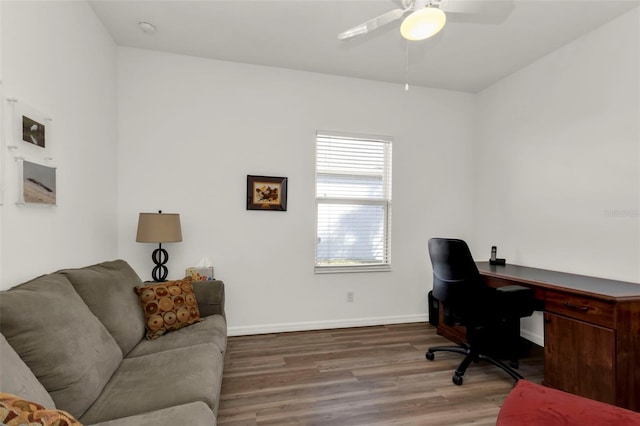 home office featuring hardwood / wood-style flooring and ceiling fan