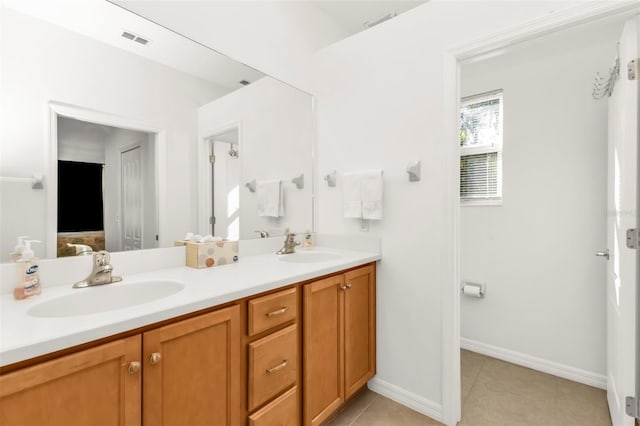 bathroom with vanity and tile patterned flooring