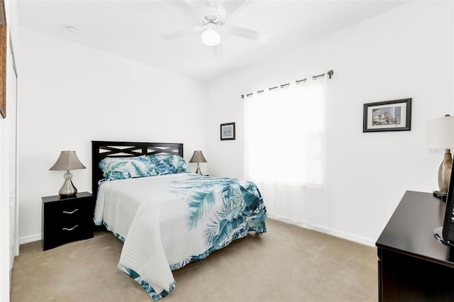 bedroom featuring ceiling fan and light colored carpet