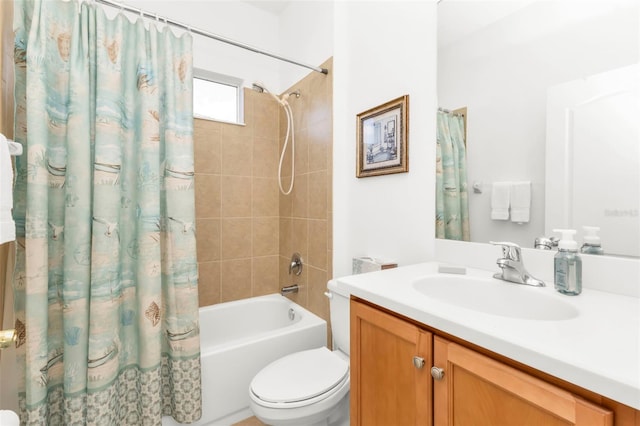 full bathroom featuring shower / tub combo, vanity, and toilet