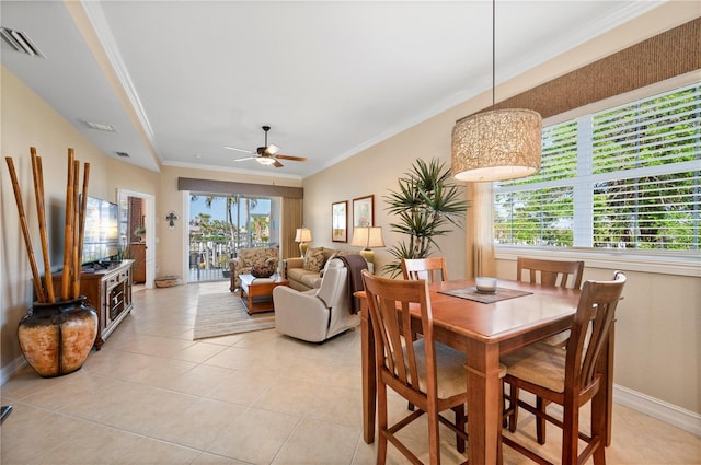 dining space featuring light tile patterned floors, a wealth of natural light, ornamental molding, and ceiling fan