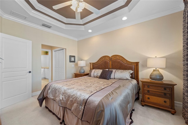 bedroom featuring light carpet, crown molding, and a closet