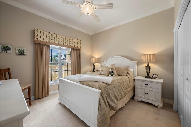 bedroom with light carpet, crown molding, and ceiling fan