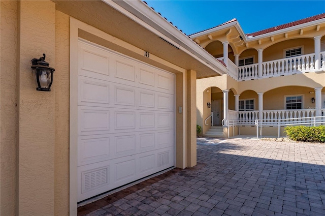 view of front of property with a garage