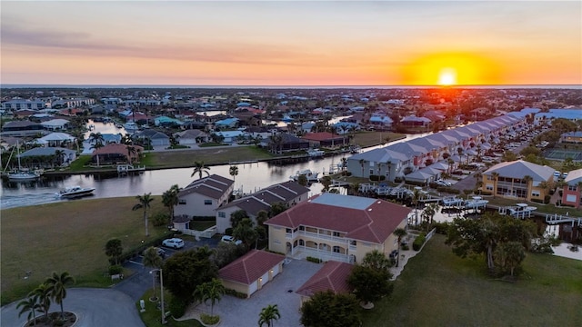 aerial view at dusk with a water view