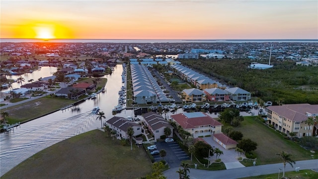 aerial view at dusk with a water view