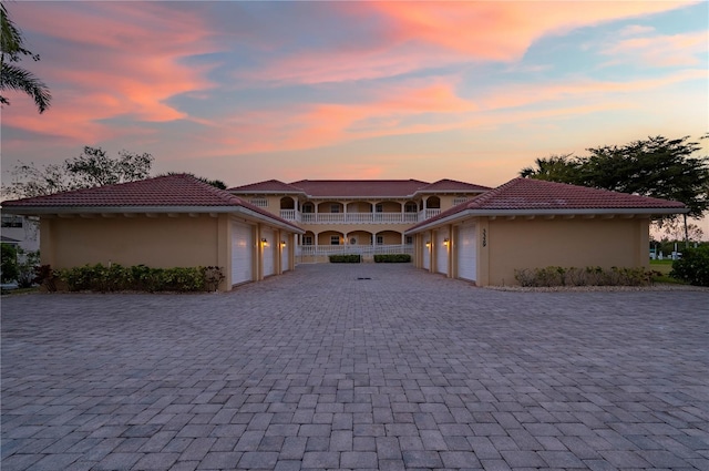 mediterranean / spanish house with a garage