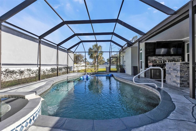 view of swimming pool with a patio, a lanai, an outdoor bar, and pool water feature