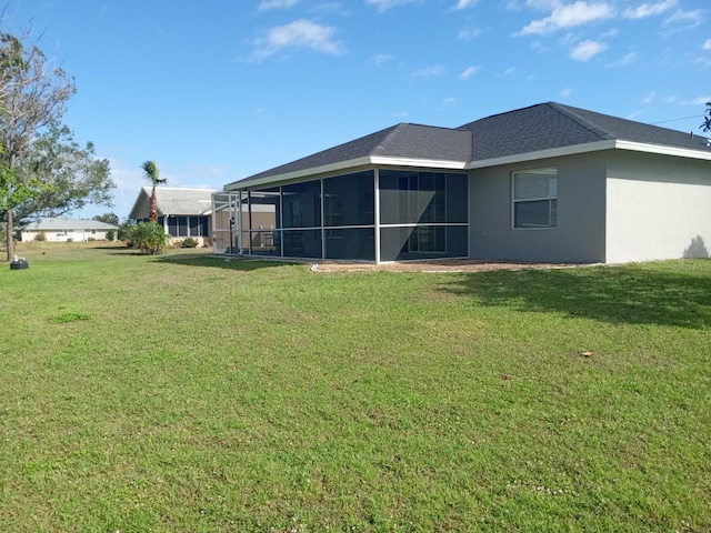 back of property featuring a yard