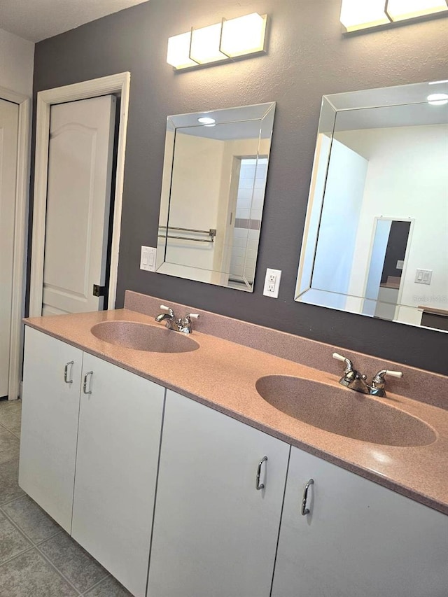 bathroom with vanity and tile patterned floors