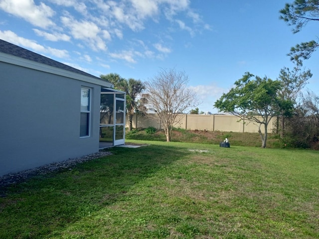 view of yard with a sunroom