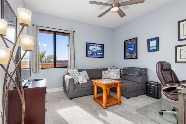 home office with light carpet and ceiling fan