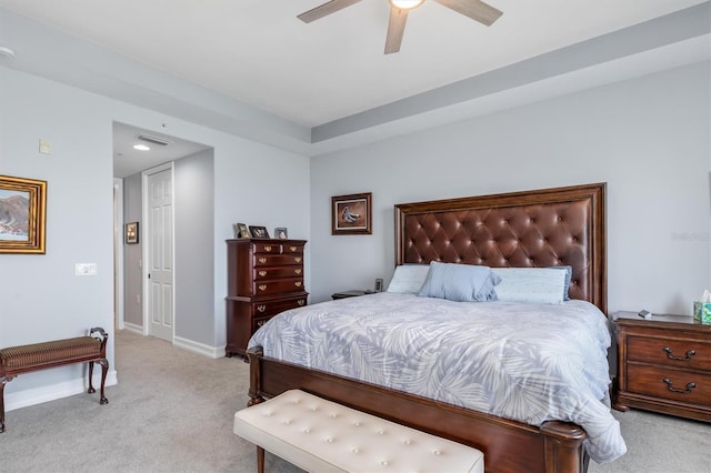 bedroom featuring light colored carpet and ceiling fan