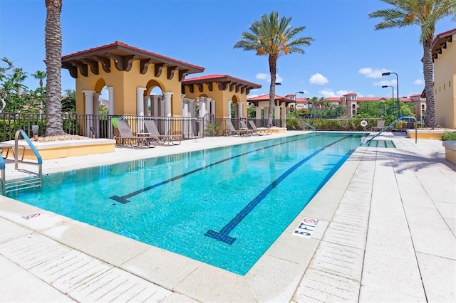 view of swimming pool with a patio area