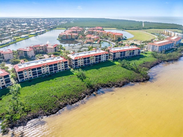 birds eye view of property with a water view