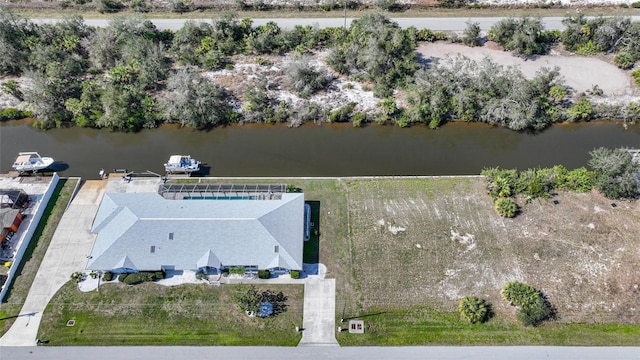 birds eye view of property featuring a water view