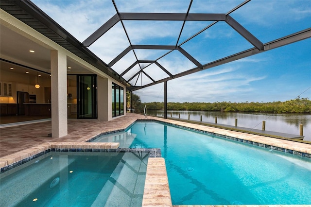 view of pool featuring a lanai, a patio, and a water view