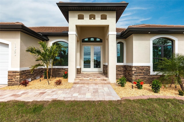 property entrance featuring french doors