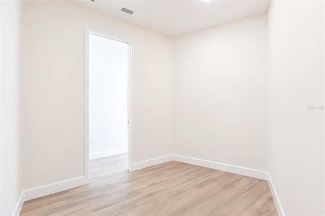 spare room featuring light wood-type flooring