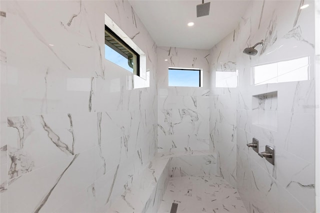 bathroom featuring a tile shower