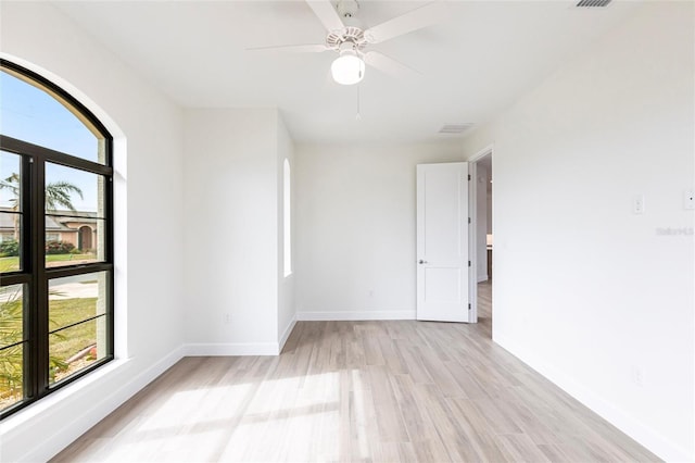 unfurnished room featuring ceiling fan and light wood-type flooring