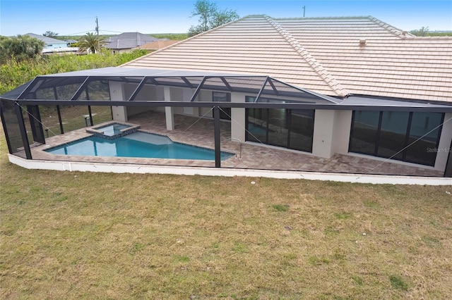 back of house featuring a lanai, a yard, a patio area, and a pool with hot tub