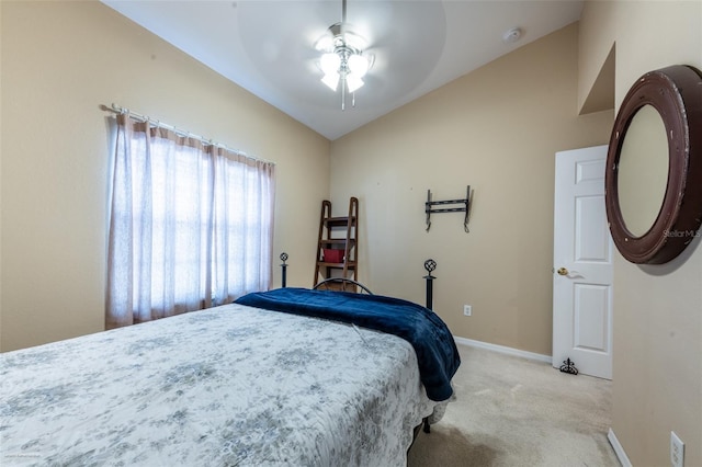 carpeted bedroom featuring lofted ceiling and ceiling fan