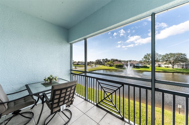 sunroom with a water view