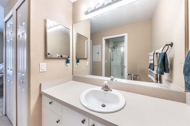 bathroom with vanity and an enclosed shower