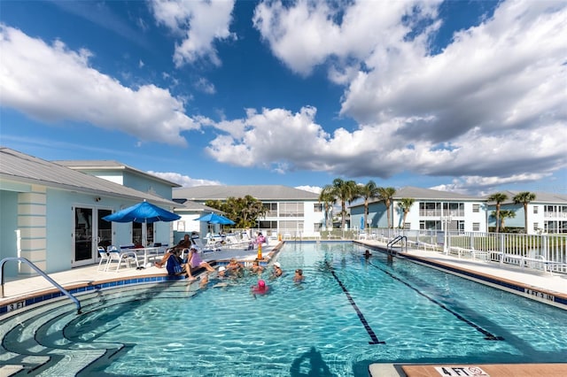 view of swimming pool featuring a patio area