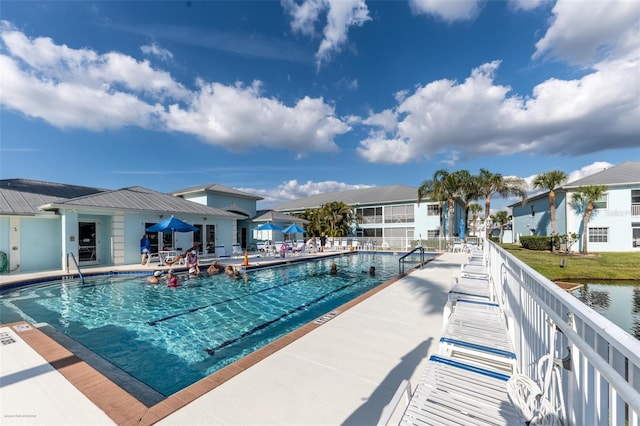 view of swimming pool featuring a patio area