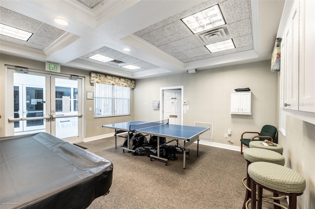 game room with french doors, coffered ceiling, crown molding, carpet flooring, and beam ceiling