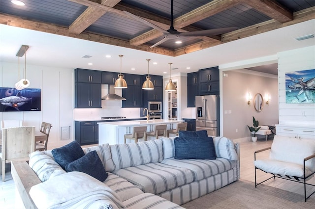 living room with coffered ceiling, ceiling fan, and beamed ceiling