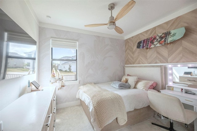 bedroom featuring light colored carpet and ceiling fan