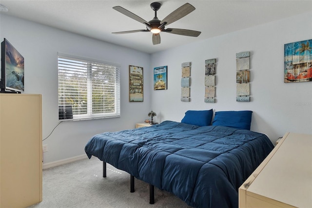 bedroom with light colored carpet and ceiling fan