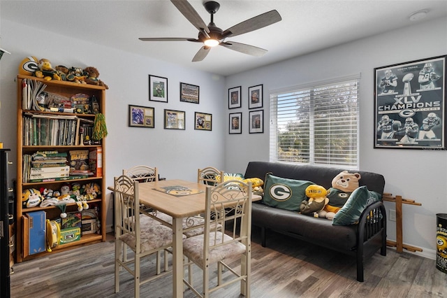 dining room with ceiling fan and wood-type flooring