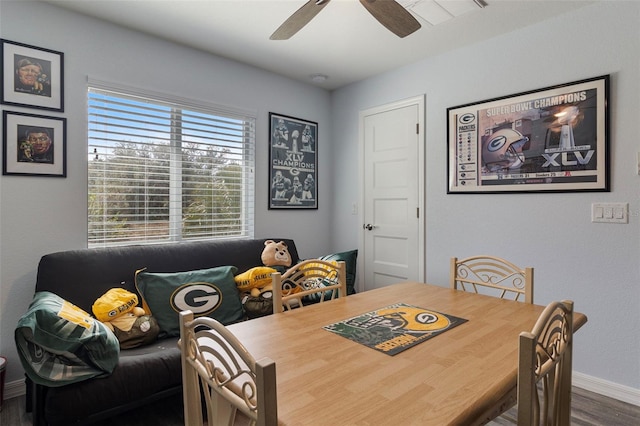 dining area featuring hardwood / wood-style floors and ceiling fan