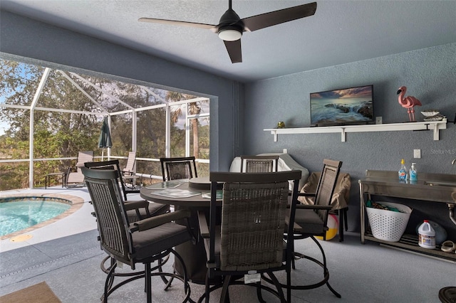 dining room featuring ceiling fan and a textured ceiling