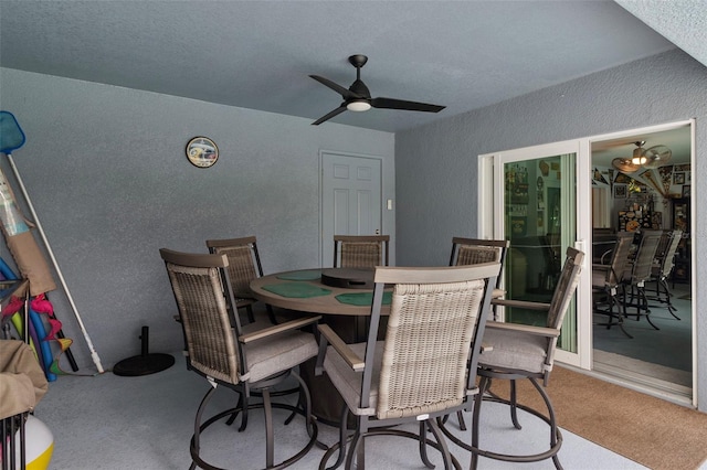 dining room with ceiling fan and carpet floors