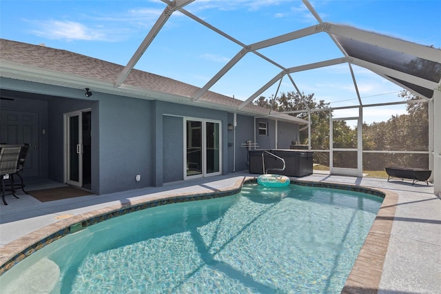 view of pool featuring a lanai and a patio