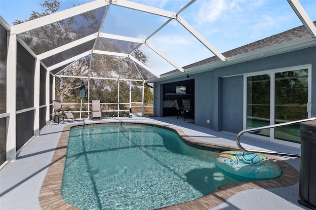 view of pool featuring a patio and a lanai