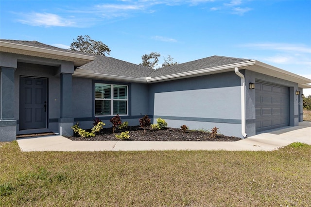 view of side of property with a garage and a yard