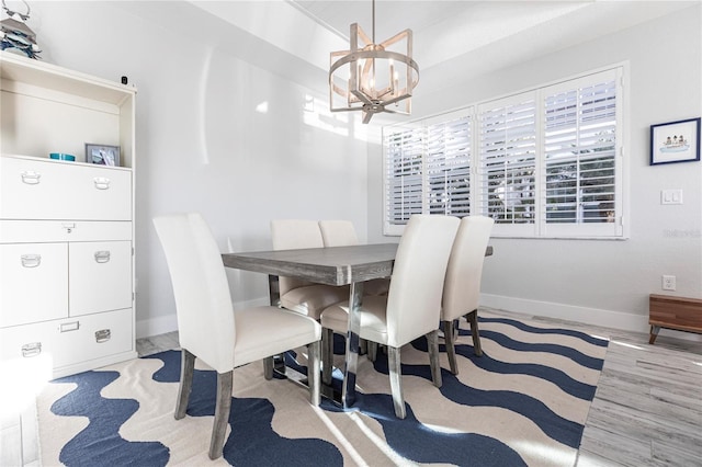 dining space with an inviting chandelier