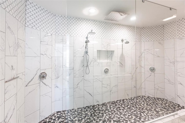 bathroom with tiled shower