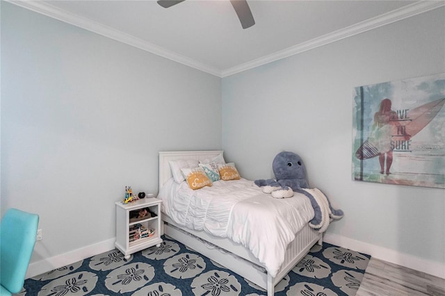 bedroom featuring crown molding, wood-type flooring, and ceiling fan