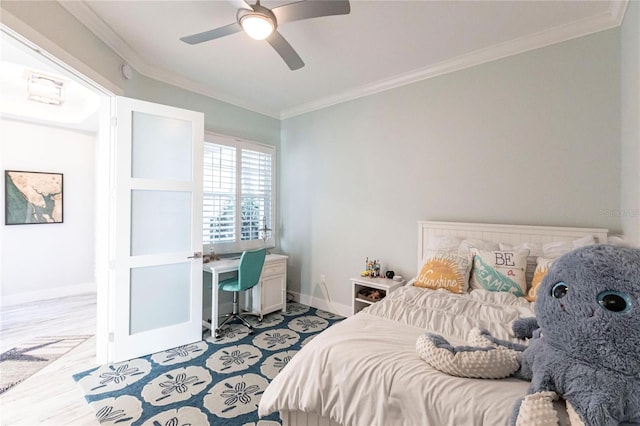 bedroom with ornamental molding and ceiling fan